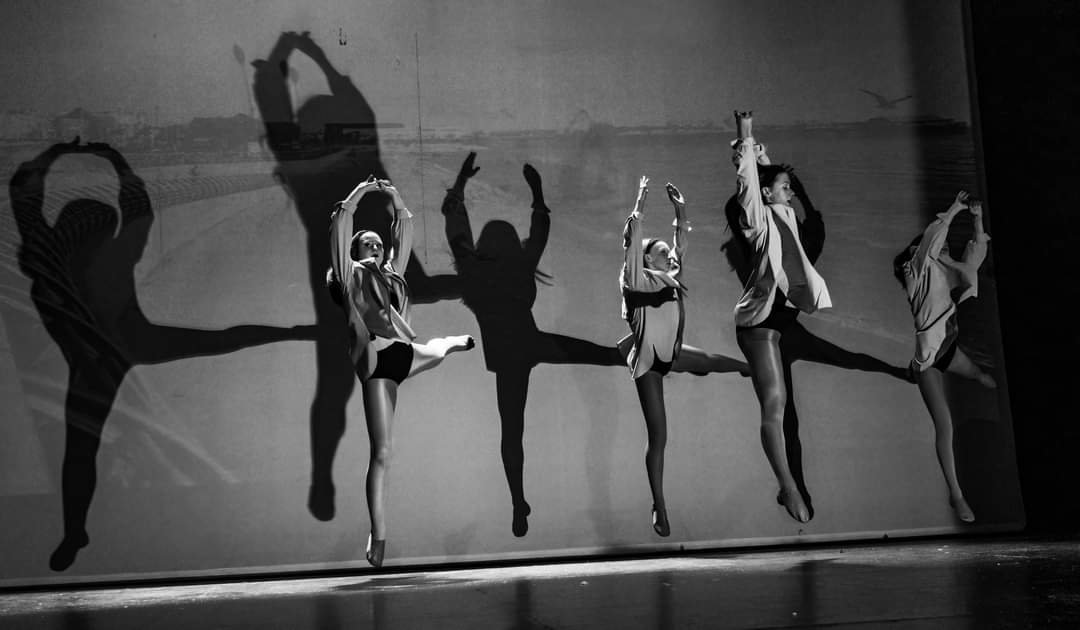 Black and white silhouettes of Whittaker's dancers in the studio